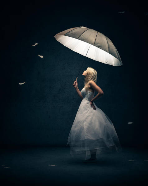 Woman Holding Umbrella with Floating Feathers Poster