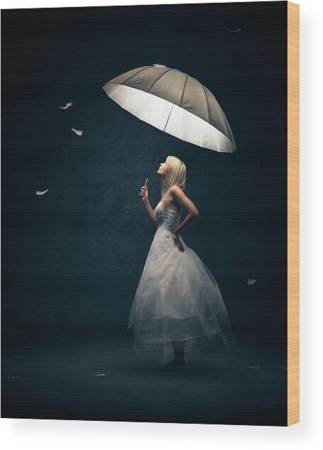 Woman Holding Umbrella with Floating Feathers Wood Print